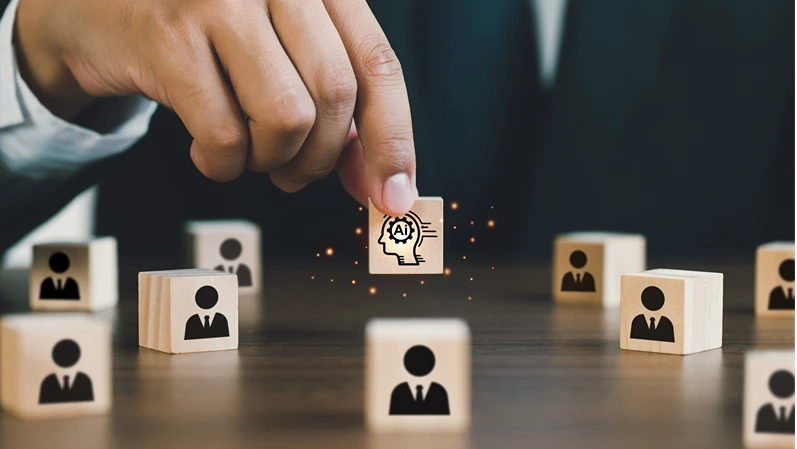  Businessman picked up a wooden block with an Ai icon, surrounded by wooden blocks with a human icon. AI vs human competition.the impact of artificial intelligence and robotics on Unemployment.