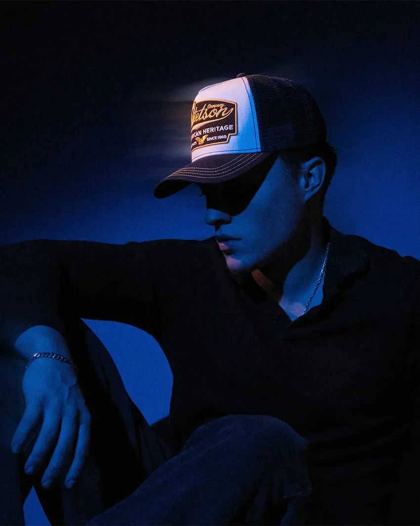Patrick Pankalla’s project thumbnail of artist Asger in a Stetson hat, featuring dramatic blue studio lighting.