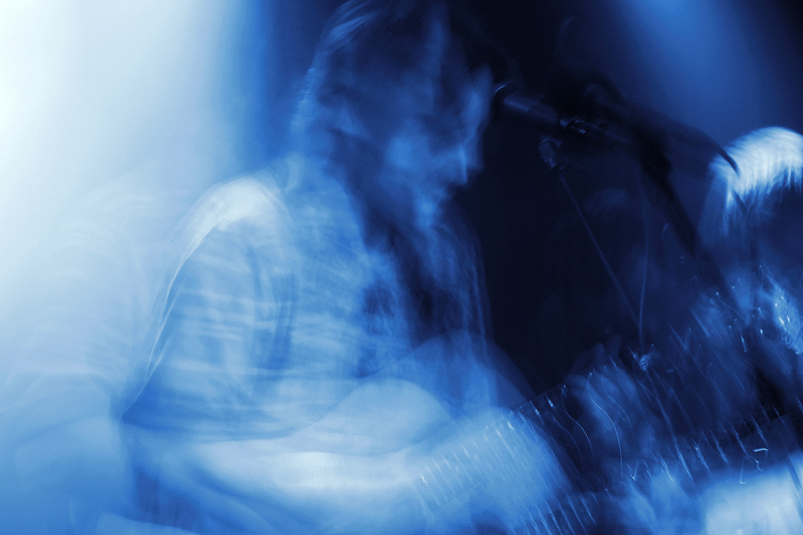 Thoughtfool performing live at Rust in Copenhagen with creative motion blur and blue stage lighting.