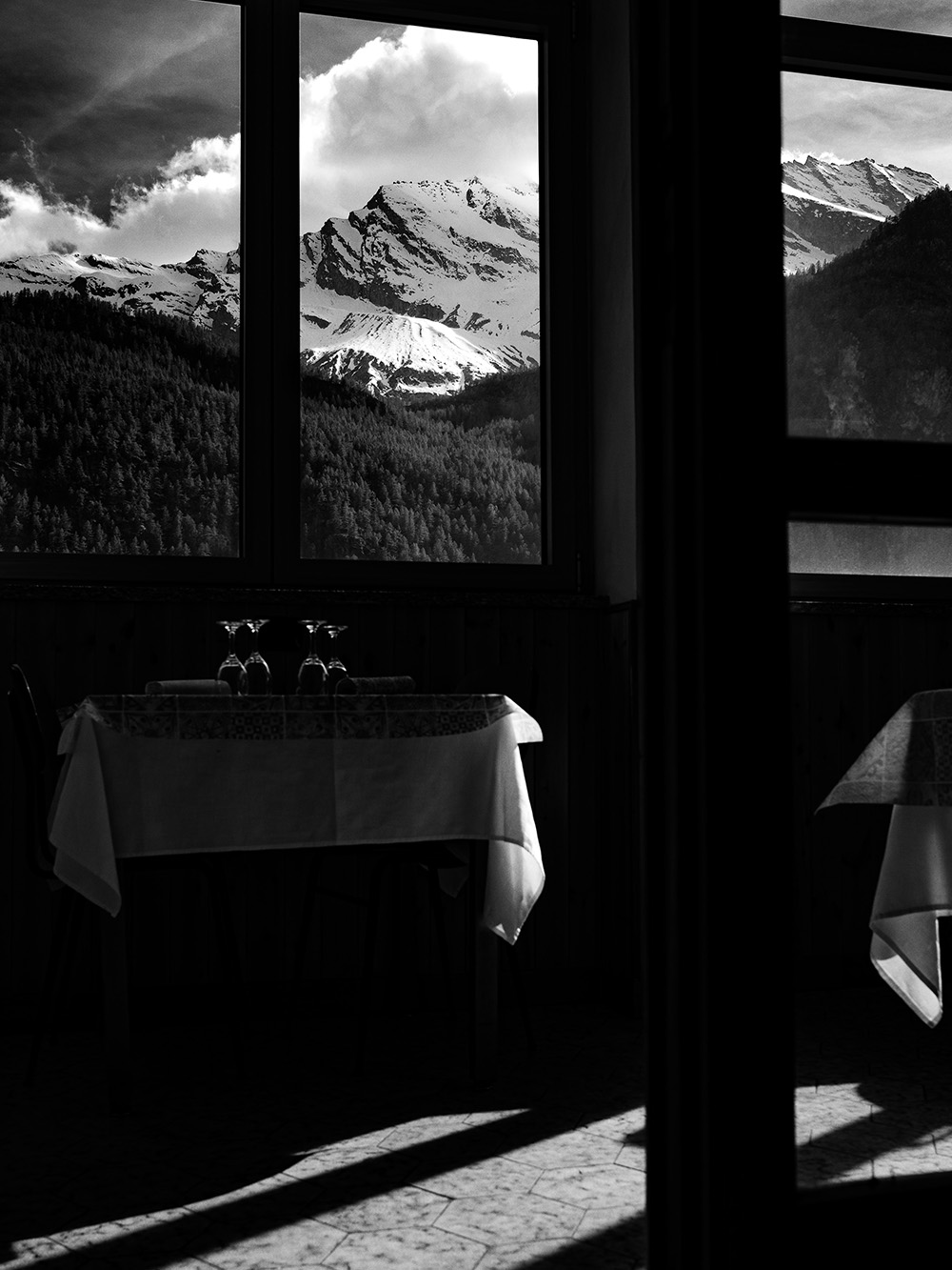 Window view overlooking Gran Paradiso National Park in Italy photographed by Patrick Pankalla.