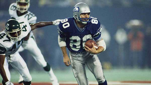 Picture of Steve Largent running across the football field