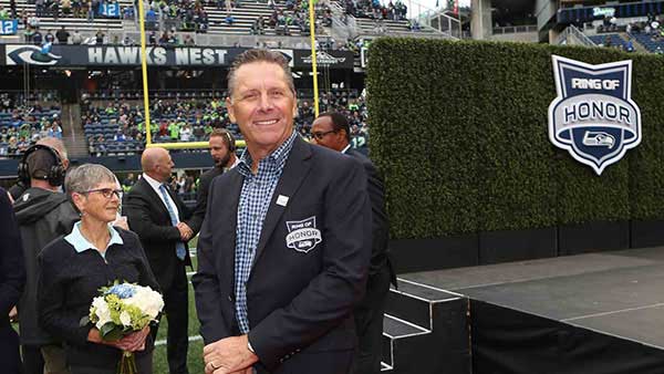 Steve Largent posing for his ring of honor ceremony