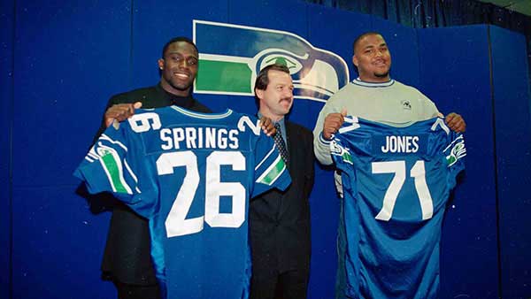 Walter Jones posing with his new Seahawks uniform just drafted