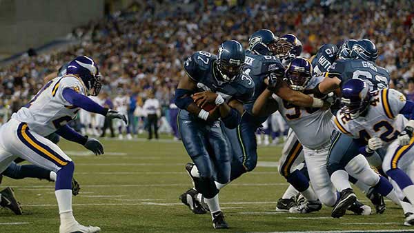 Shaun Alexander running through defenders