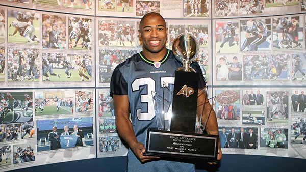Shaun Alexander posing with his MVP trophy 