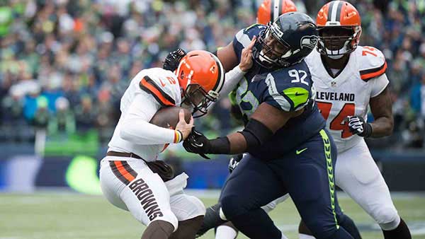 Brandon Mebane tackling a quarterback