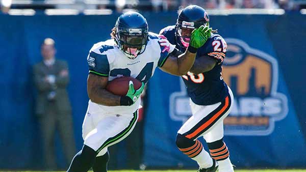 Marshawn Lynch running away from a defender