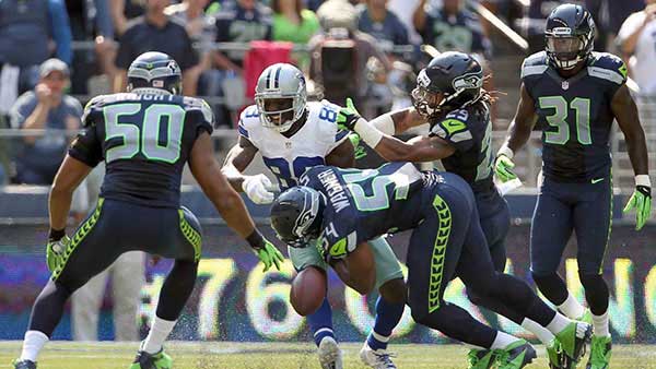 Group of Seahawks wearing home uniforms