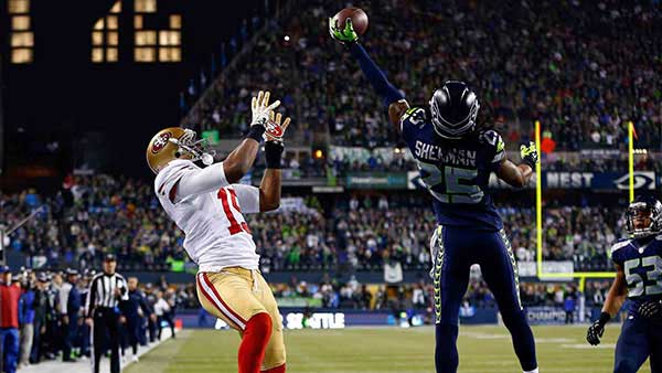 Richard Sherman tipping as pass for the game sealing interception