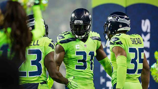 Seahawks player in action lime green uniforms