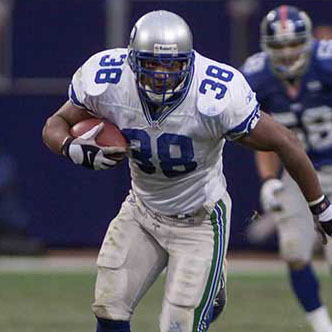 Mack Strong running with the football on the field