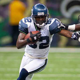 Darell Jackson stiff arming a player