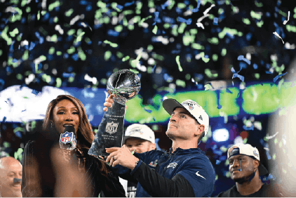 Coach Mike Macdonald holds the Lombardi Trophy