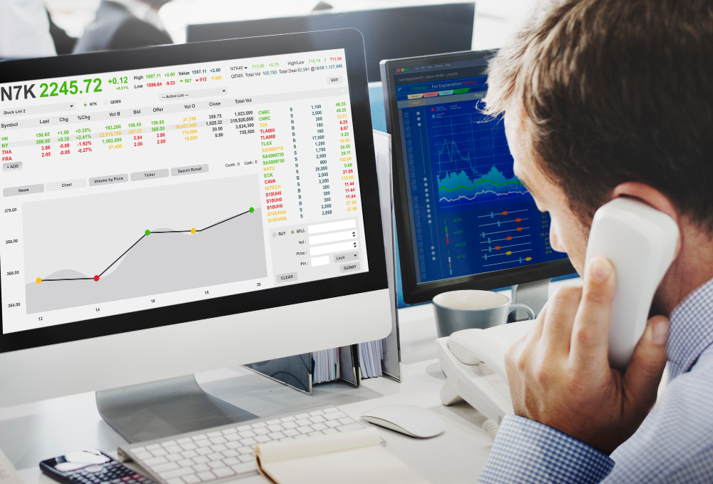 man trading and on a call - Best Time of Day to Trade Stocks