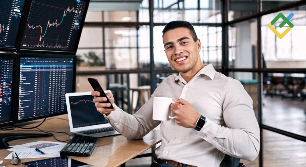 man trading and smiling - Do You Pay Tax On Forex Trading