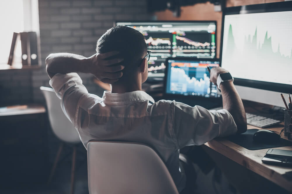man in a white shirt - What is Risk Management in Trading