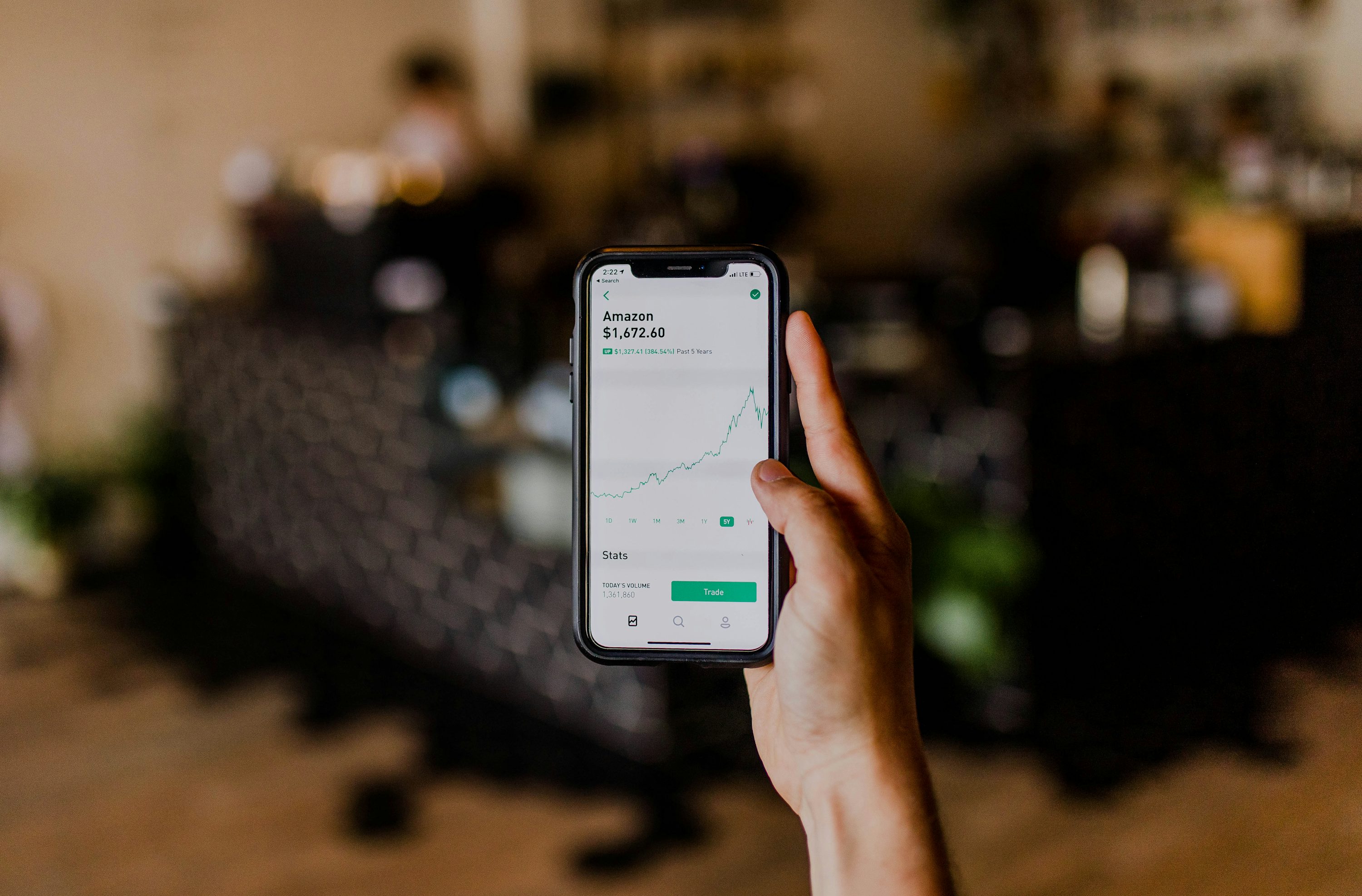 person holding black iPhone - Algorithmic Trading Risk Management