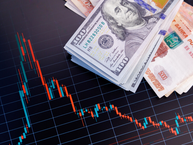 dollar bills on trading graphs - How to Trade and Make Money