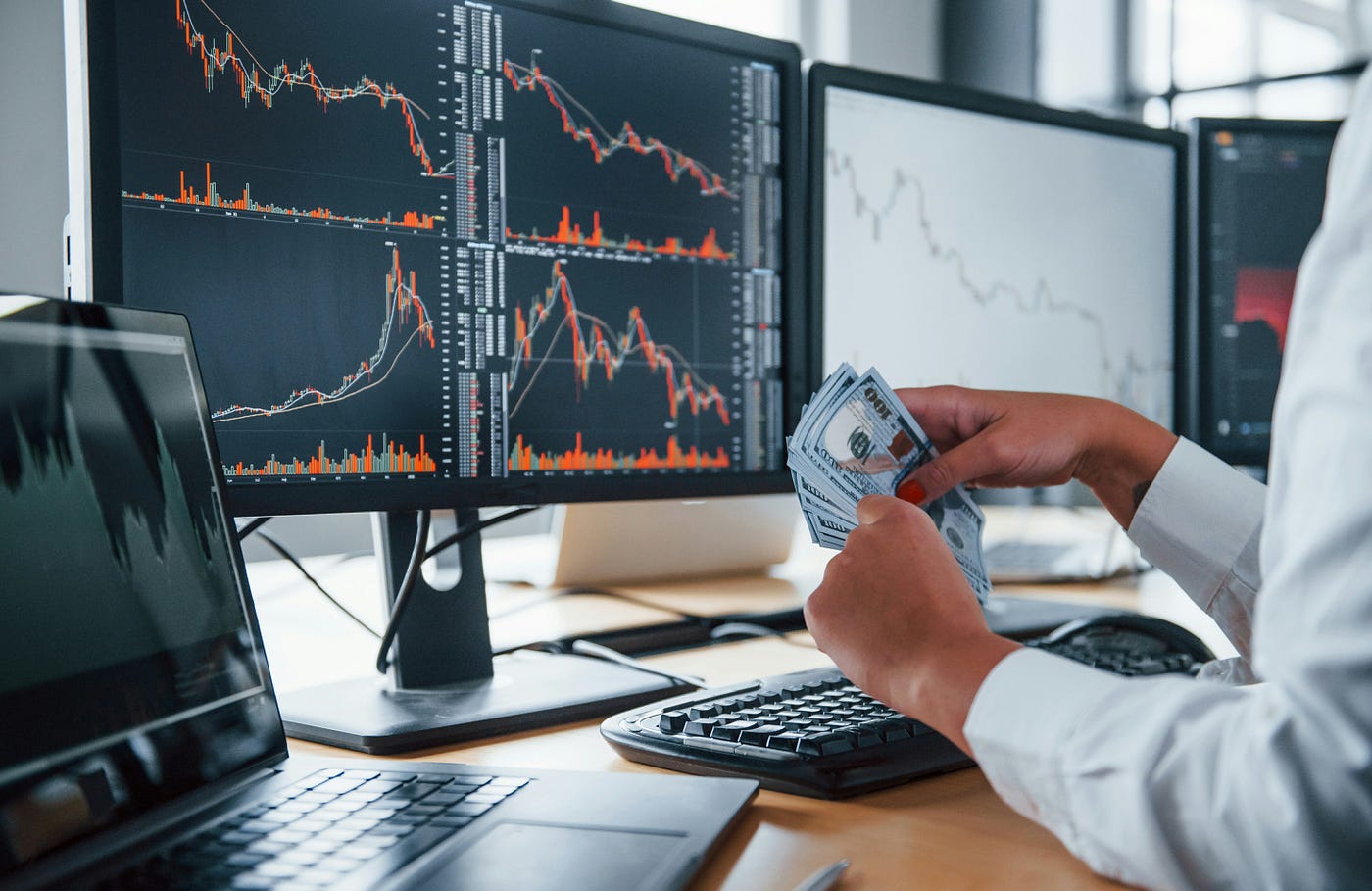 woman holding trading money - Can Day Trading Make You Rich