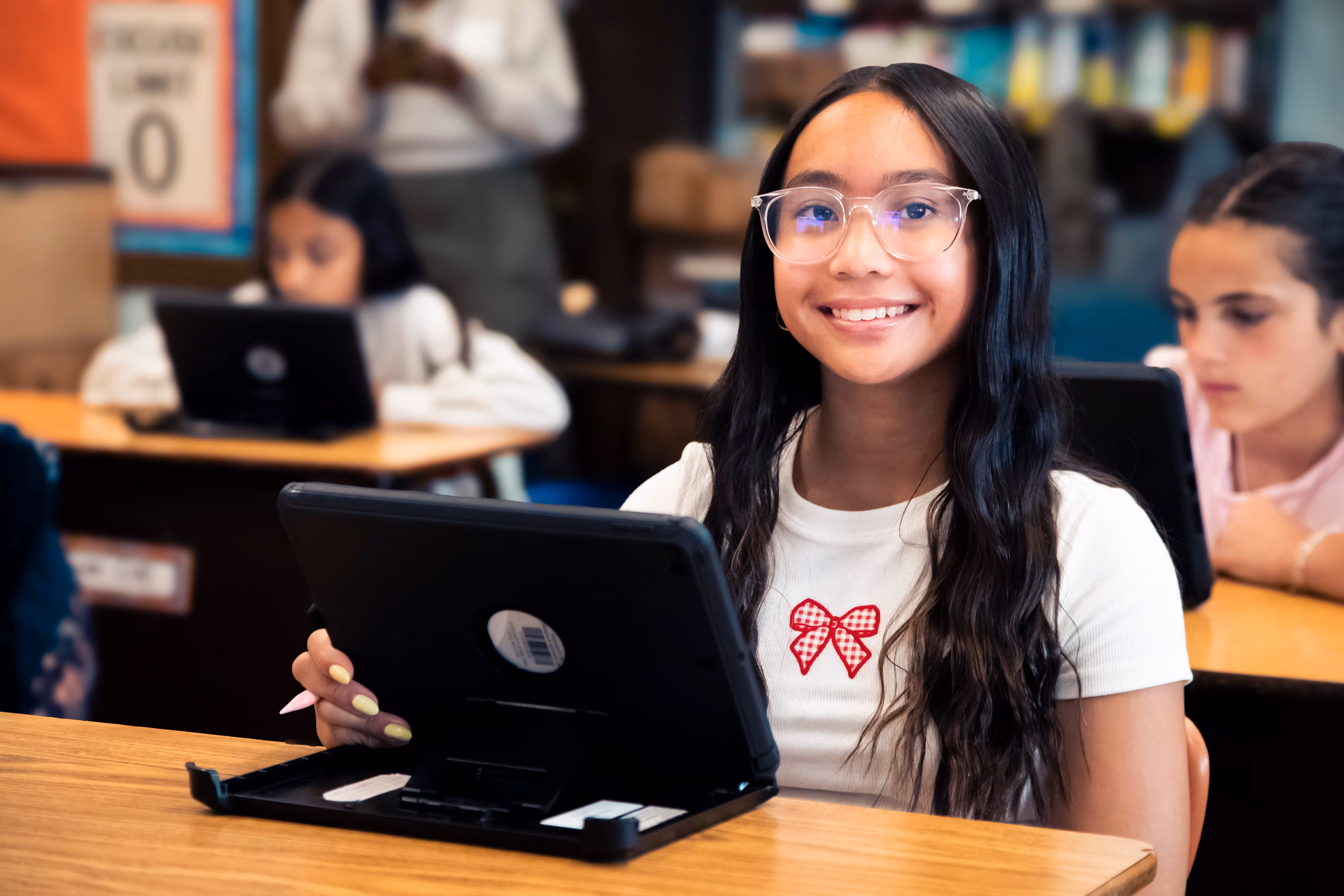 Six grade girl is smiling and using Magma