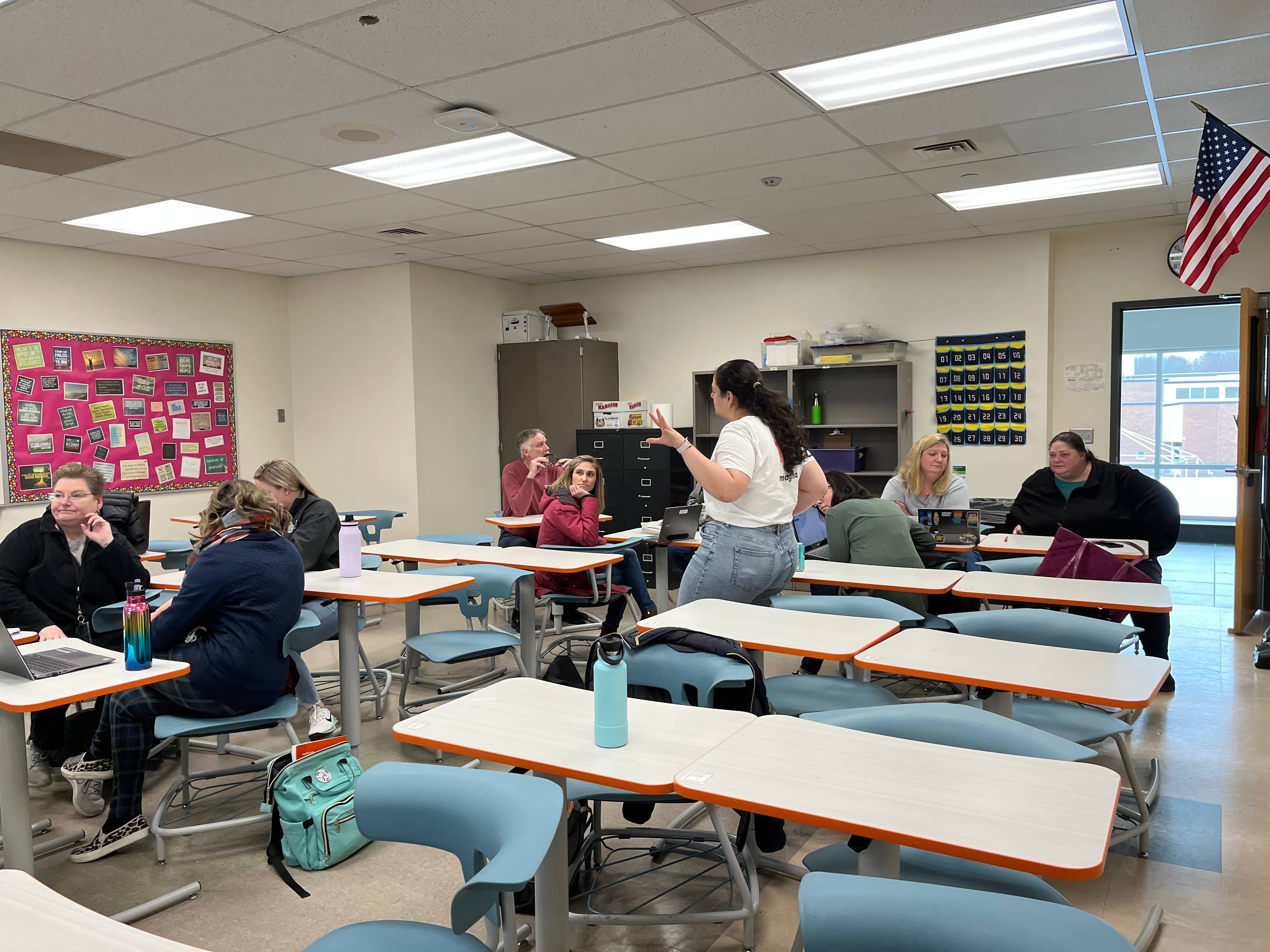 Teachers participating in a collaborative math professional development session in a classroom at Bethlehem Central School District.
