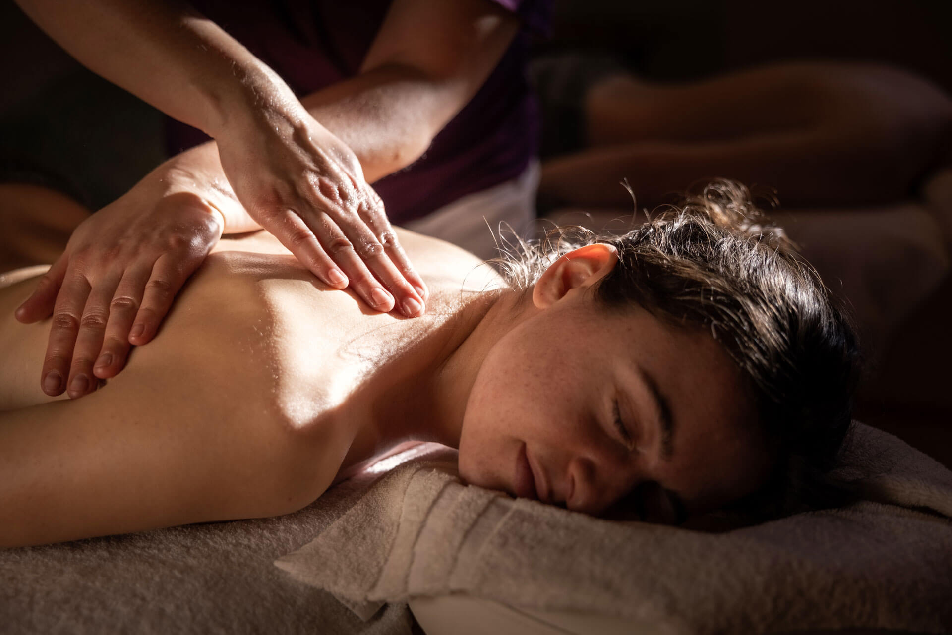 Woman enjoying a relaxing massage at Belarosa Chalet