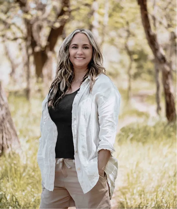 Chantal Dubois, owner and lead photographer of Shutterpix, standing outdoors with over 25 years of industry experience