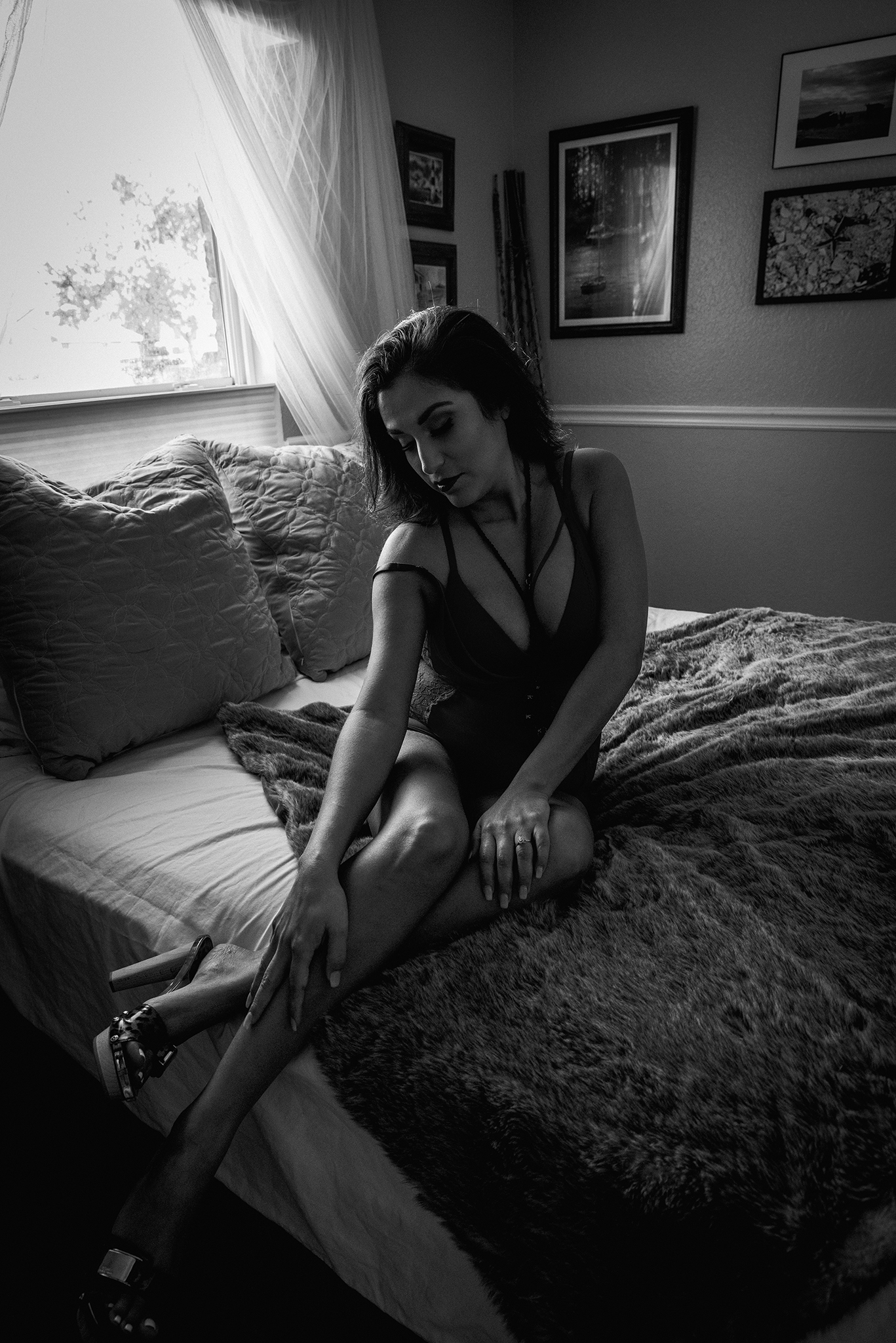 Corpus Christi photograph with intimate boudoir portrait of a woman on the edge of her bed 