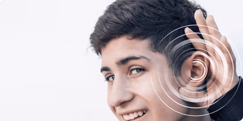 A young man pointing his ear