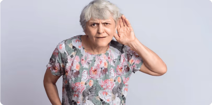 A older woman pointing ear