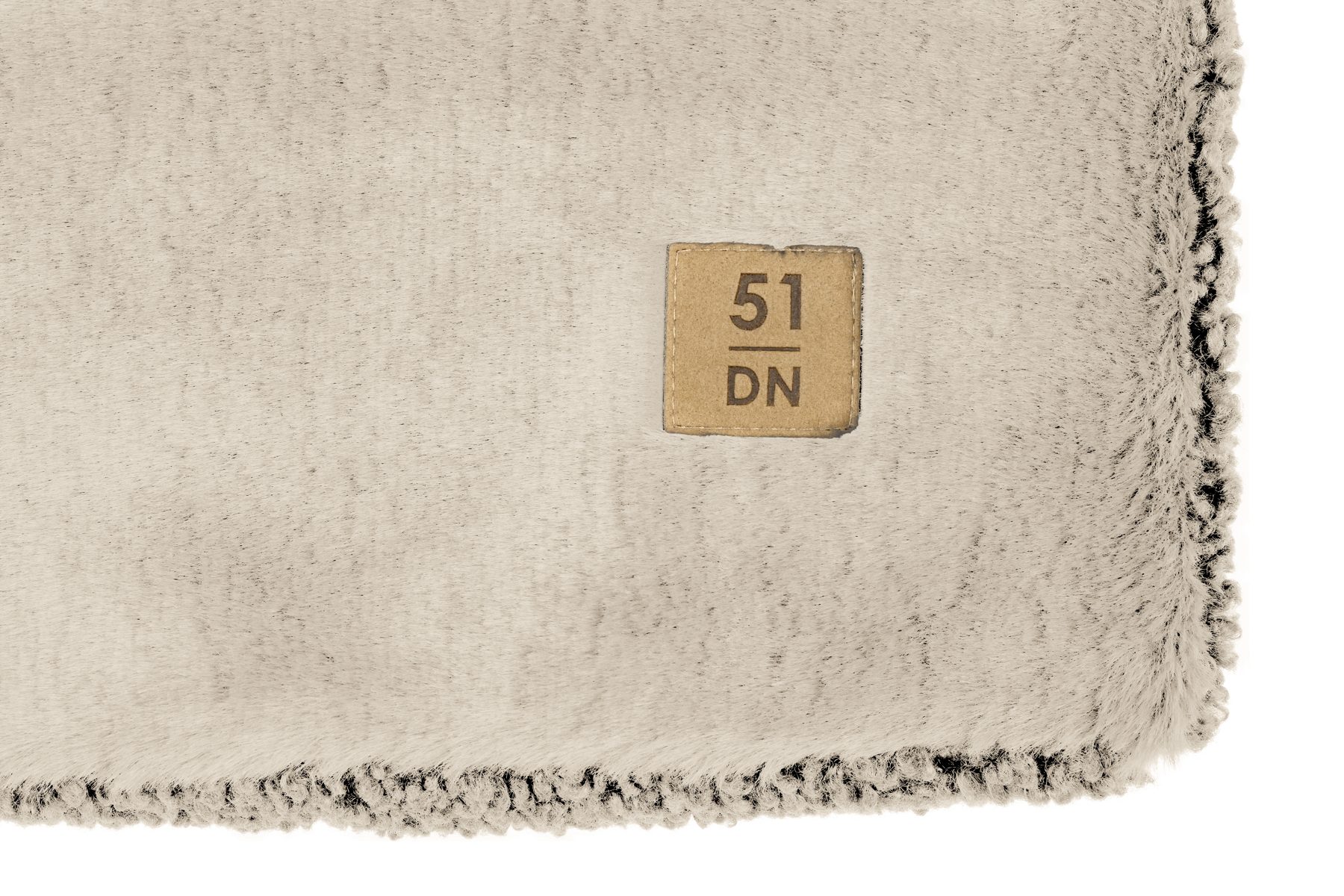 Close-up of the beige Montana fabric with the 51 DN label