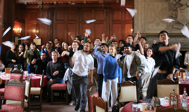 Participants celebrating together during a live Rituals for Performance leadership workshop.