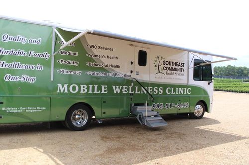 a green and white mobile wellness clinic