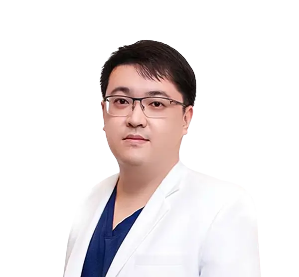 Portrait of a man wearing glasses, a white coat, and a dark blue shirt.