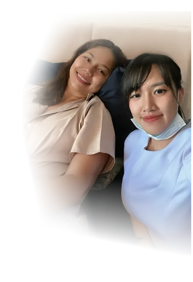 Patient smiling in bed next to a nurse taking a selfie