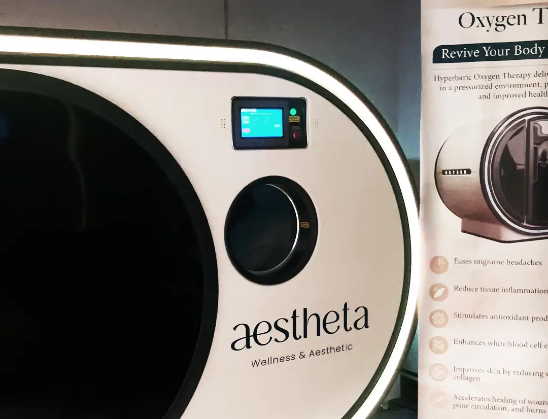 Patient resting inside a hyperbaric oxygen chamber during a recovery treatment