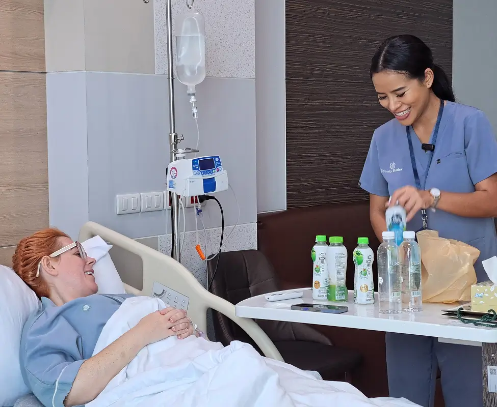 Nurse and surgeon speaking with a patient at the hospital before a follow-up