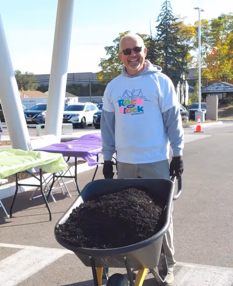 A picture of a volunteer at a Five Rivers Health Centers volunteer Rock the Block event, 2024