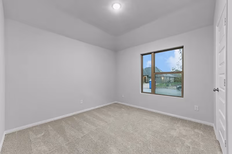 Bedroom with window and carpet