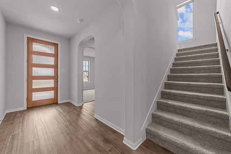 Shot of 5 panel front door and stairs