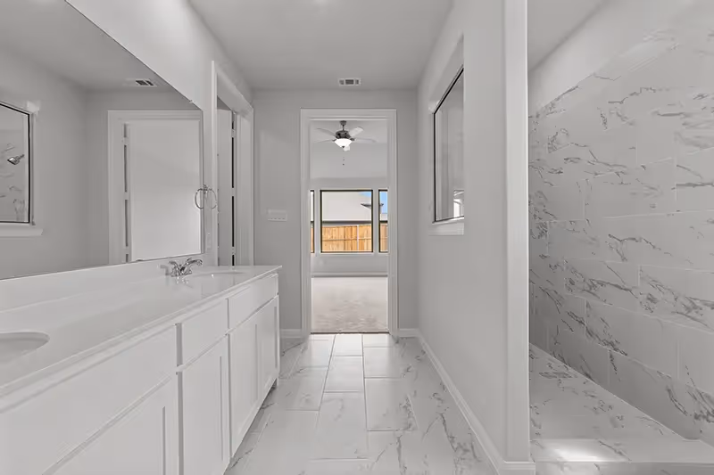 Owners bath with double vanity and oversized shower
