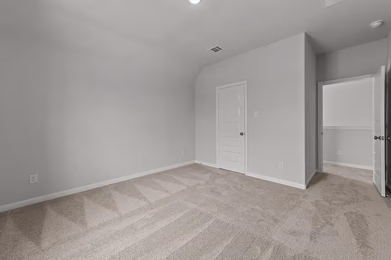 Bedroom with closet and carpet
