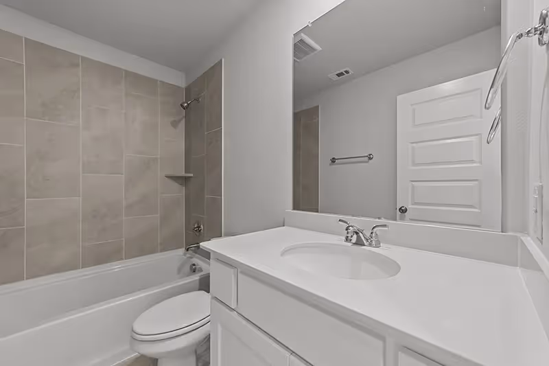 Bathroom with tub/shower combo upstairs and single sink