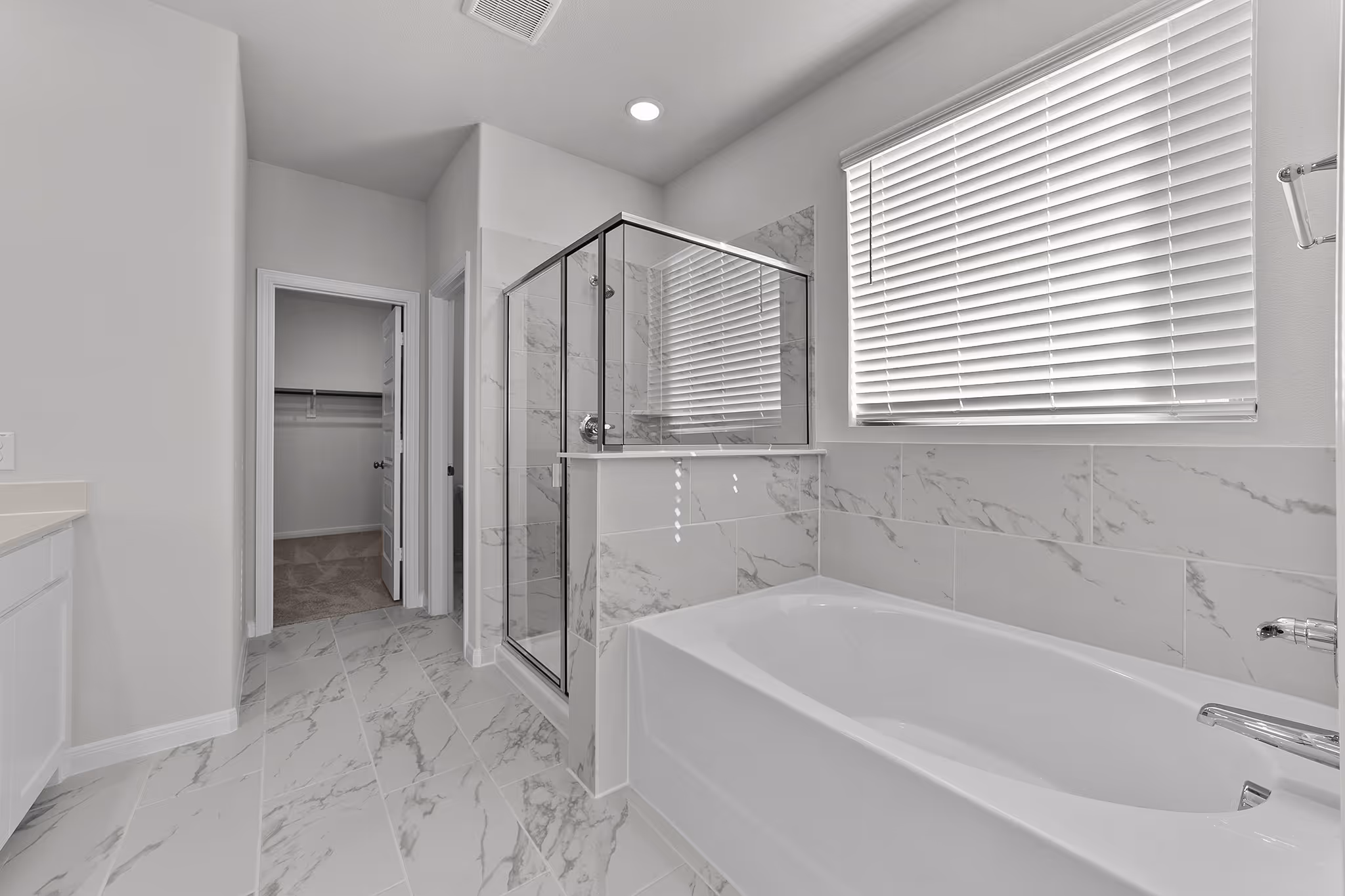 owners bath with separate tub and shower