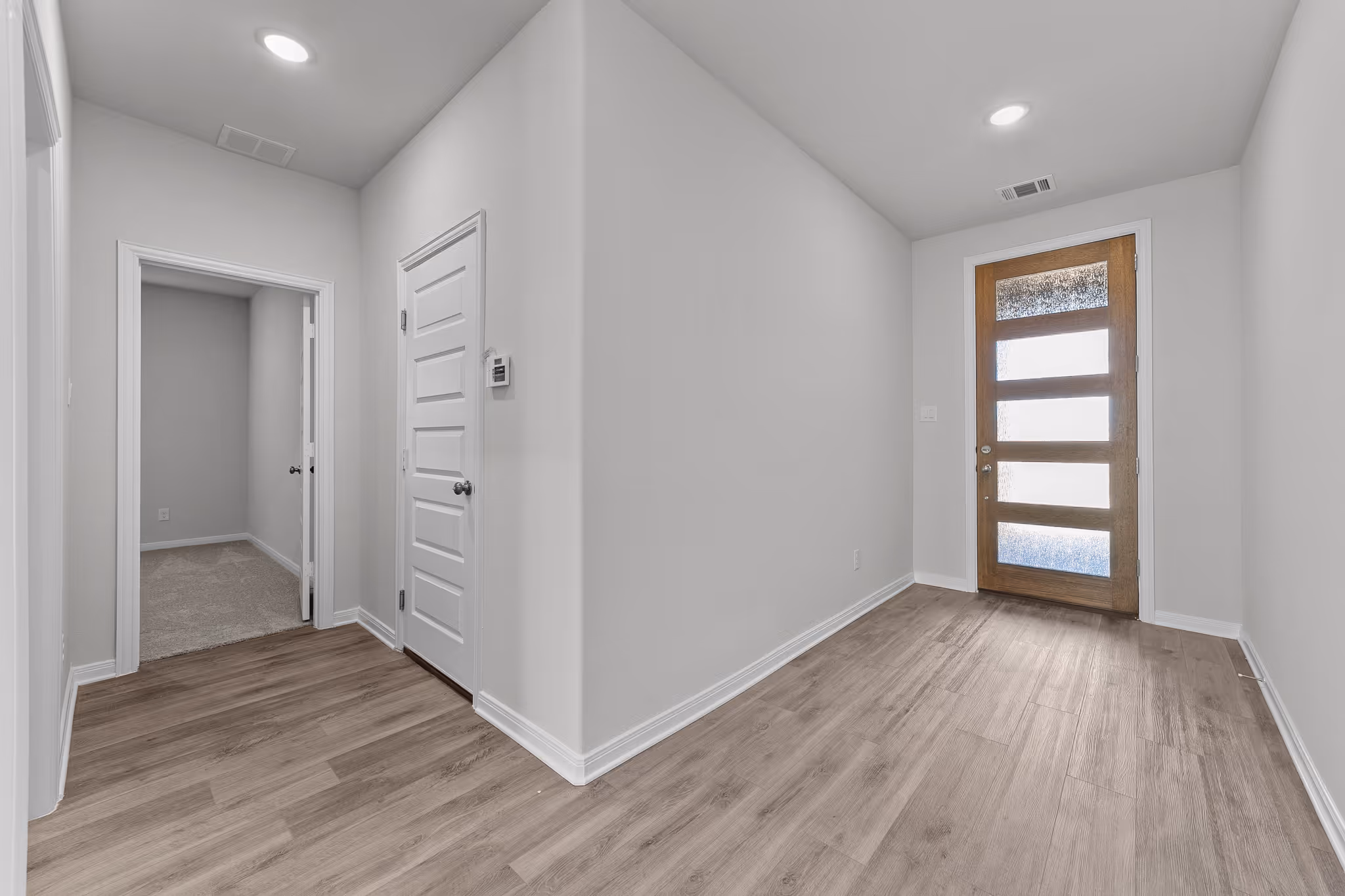entry way with shot of 5 panel door