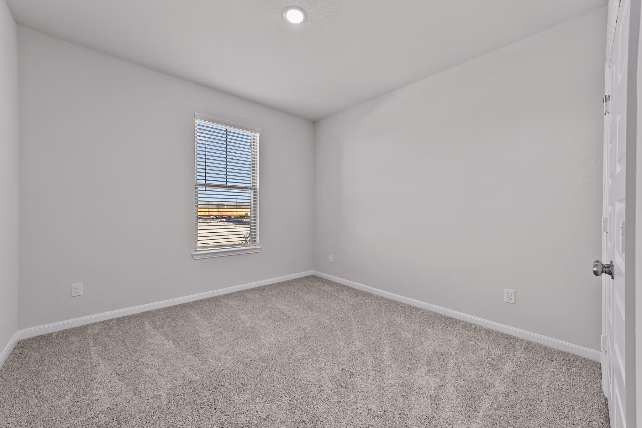 bedroom shot with carpet and one window
