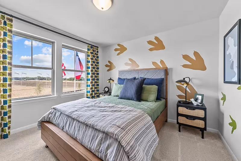 bedroom upstairs furnished for a little bo with windows white walls and carpet