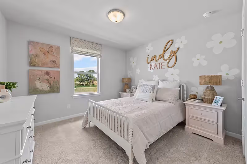 Bedroom upstairs with carpet and white walls, furnished for a little girls room