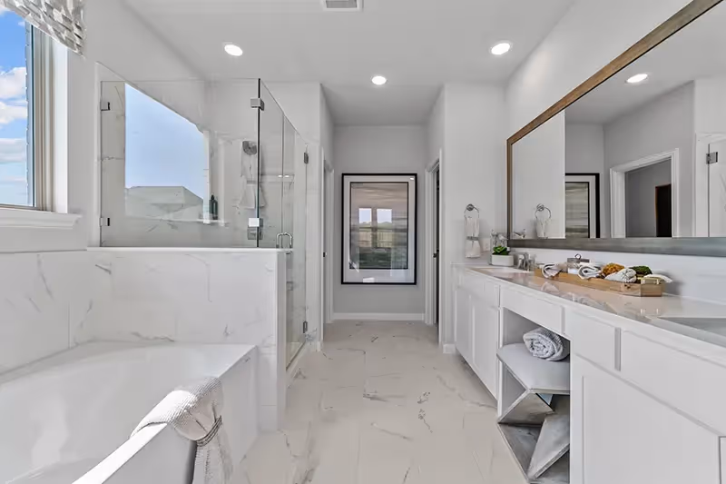 master bath with separate tub/shower and dual sinks