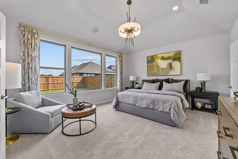master bedroom with carpet and white walls, with 3 large windows